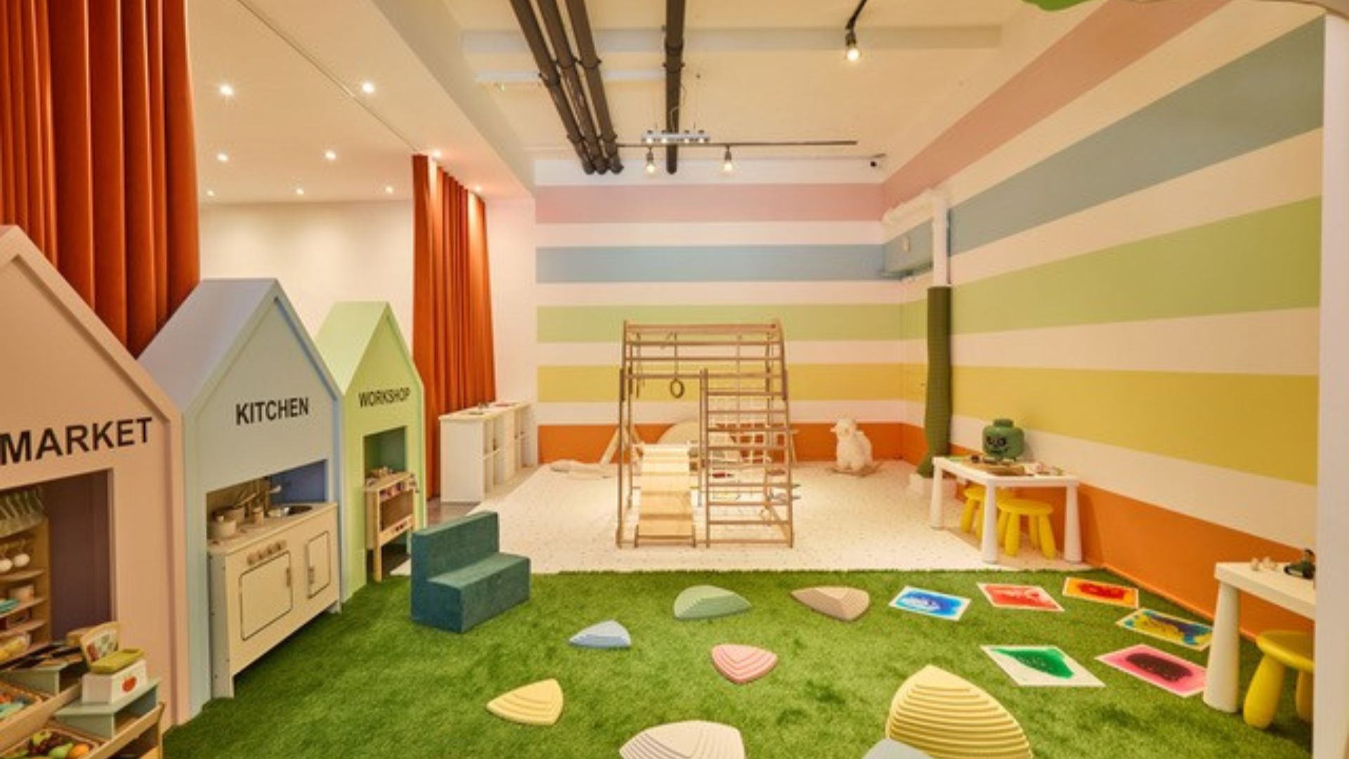 A colourful playroom at MOME London with toddler-friendly toys.