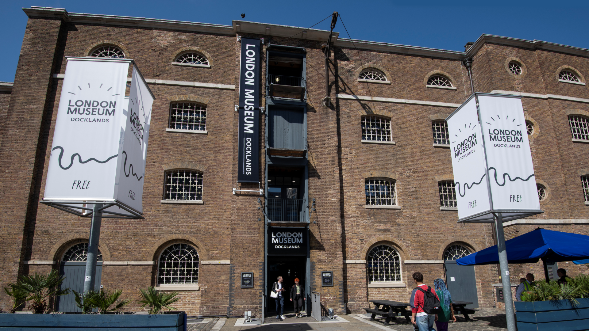 Browse more than 400 years of history through artefacts at the London Museum Docklands. Credit: John Chase. Image courtesy of London Museum Docklands. The front exterior of the London Museum Docklands with two large signs outside displaying the museum's logo