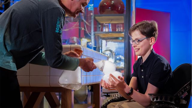 Engineer carrying out a dry ice demo with visitor at the Science Museum. Image courtesy of the Science Museum Group.
