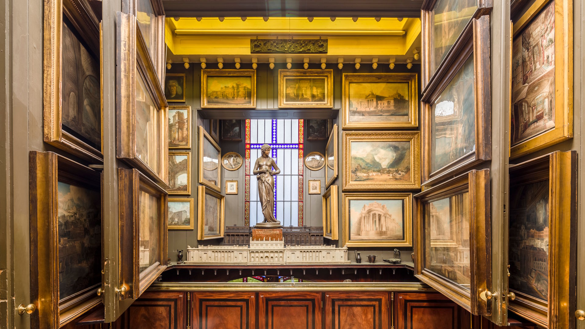 The Picture Room recess at Sir John Soane's Museum. Photo: Gareth Gardener. Image courtesy of Sir John Soane's Museum. The various panels of The Picture Room wall, opened to reveal various paintings, at Sir John Soane's Museum.
