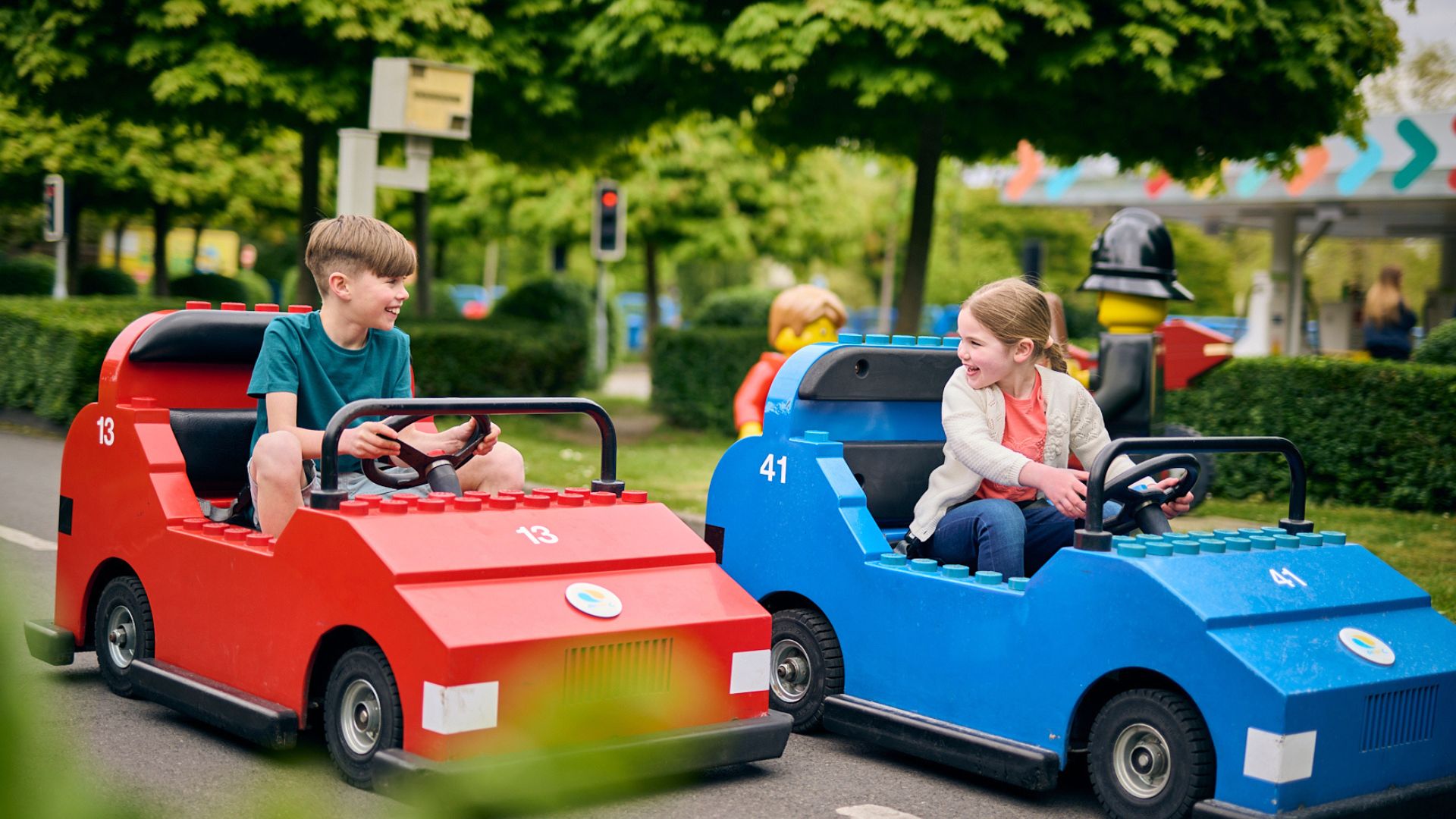 Drive colourful LEGO cars at the LEGO City Driving School at LEGOLAND Windsor. Image courtesy of Merlin. Children driving colourful LEGO cars at the LEGO City Driving School attraction at LEGOLAND Windsor.