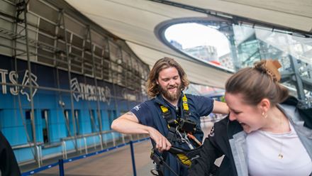 Getting ready for adventure at Up at The O2 as an expert guide helps visitors into their climbing harnesses before the ascent. Image courtesy of London & Partners/Michael Barrow
