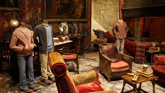 Harry, Hermione and Ron costumes in the Gryffindor common room at Warner Bros. Studio Tour London.