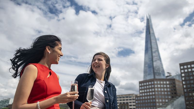 Escape the crowds and enjoy an afternoon tea as you glide along the Thames onboard a City Cruises boat. © London & Partners/Michael Barrow