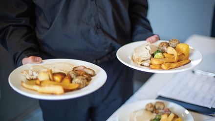 Enjoy your main course aboard a Christmas Lunch cruise on the Thames. Image courtesy of Golden Tours