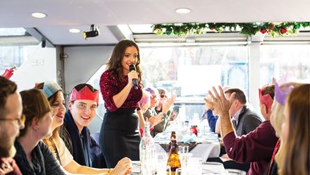 Enjoy the life entertainment at the Christmas Day lunch cruise on the Thames. Image courtesy of Golden Tours