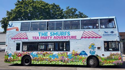 Join The Smurfs London Tea Party Adventure on a Afternoon Tea bus tour around London. Image courtesy of Golden Tours.