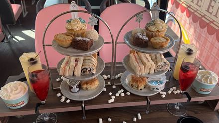 Admire iconic London landmarks and savour a festive afternoon tea on The Snowman™ Bus, with tiers of sandwiches, scones and sweet treats served alongside hot drinks. Image courtesy of Golden Tours.