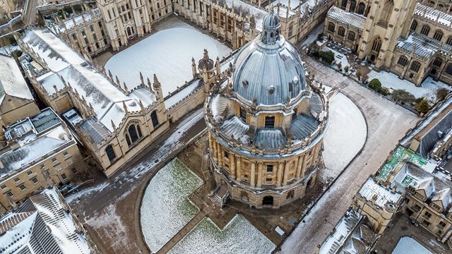 Areal view of one of the colleges from Oxford University covered with snow