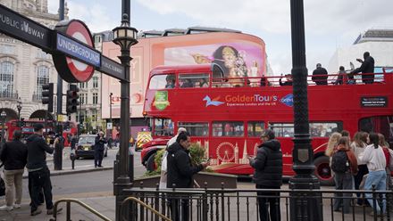 Drive past iconic Piccadilly Circus aboard a vintage red double-decker bus. Image courtesy of Golden Tours.