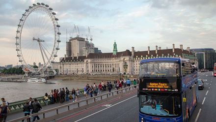 As dusk falls, hop aboard a London open top bus and soak up the evening atmosphere. Image courtesy of Golden Tours.