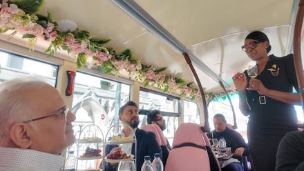 Enjoy the atmosphere of a wine bar, reimagined on a classic London bus and led by a professional sommelier. Image courtesy of Golden Tours.