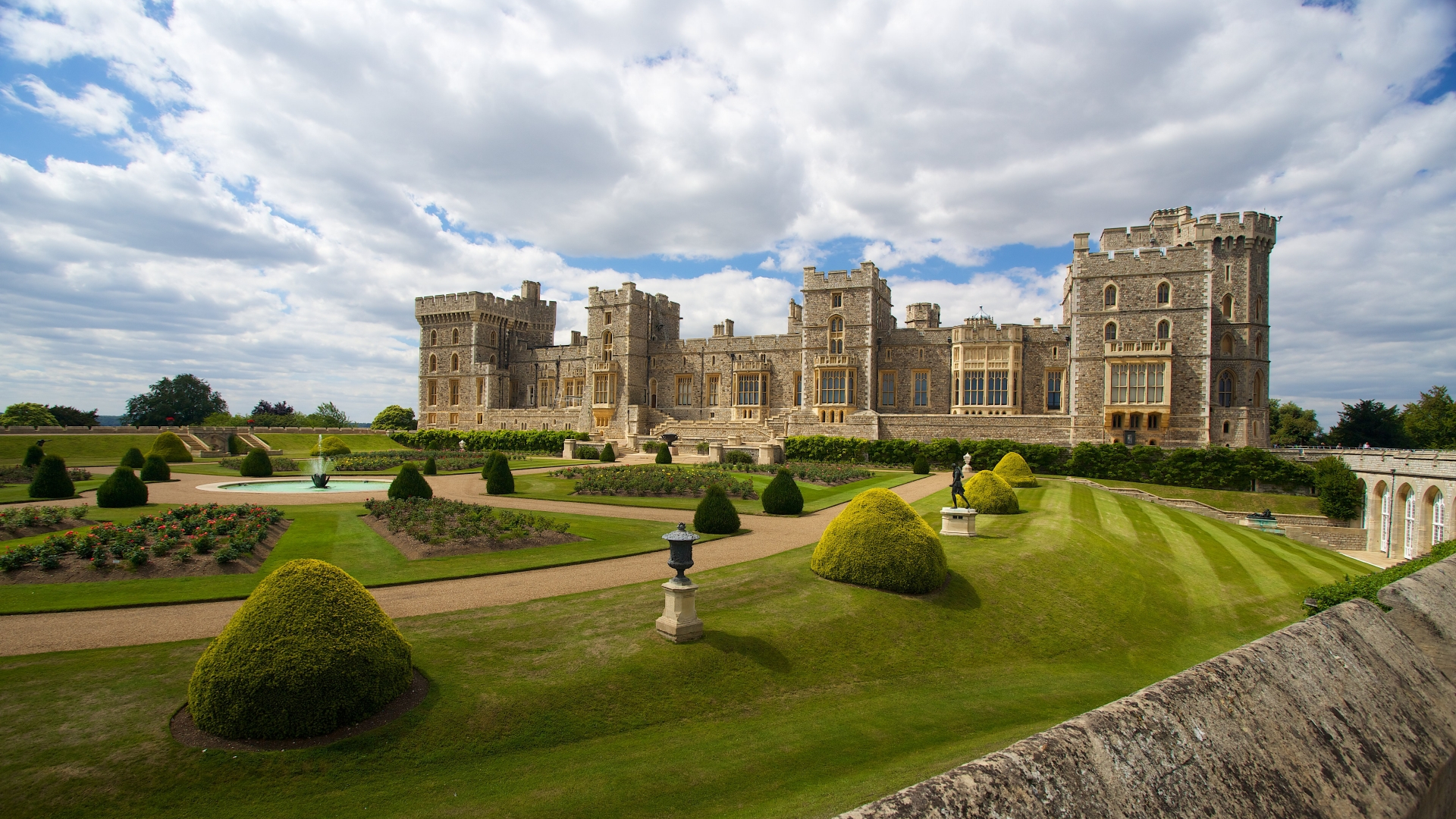Windsor Castle and grounds. Image courtesy of Shutterstock / sloukam. View of Windsor Castle and its manicured grounds.