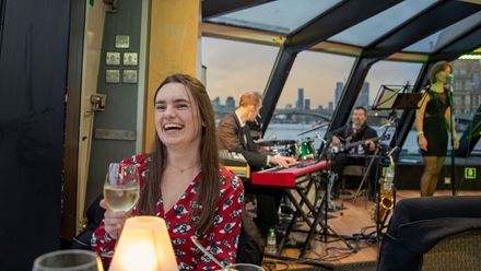 Savour a delicious three-course meal while cruising past iconic London landmarks, all set to the smooth sounds of live jazz. Image courtesy of Golden Tours