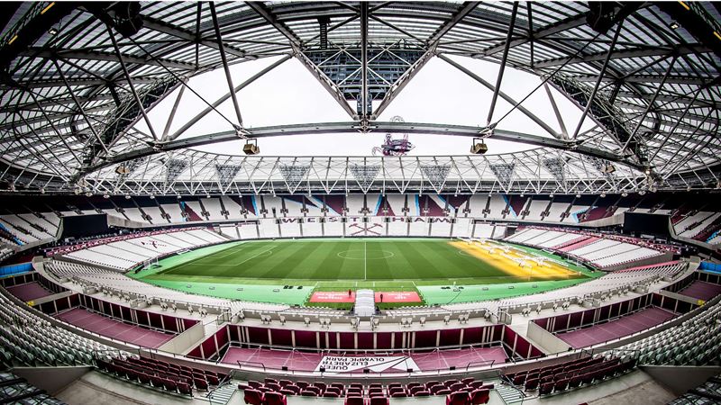 Tour London Stadium to learn more about West Ham United and the stadium's Olympic and Paralympic legacy. Credit: Marcelo Graciolli. Image courtesy of London Stadium. A view of an empty London Stadium from the back of the stand on the halfway line, showing the pitch, seating and the stadium architecture.