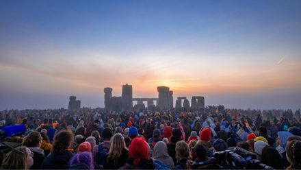 Crowds flock to the monument for the Summer Solstice at Stonehenge. Image Credit: English Heritage Trust
