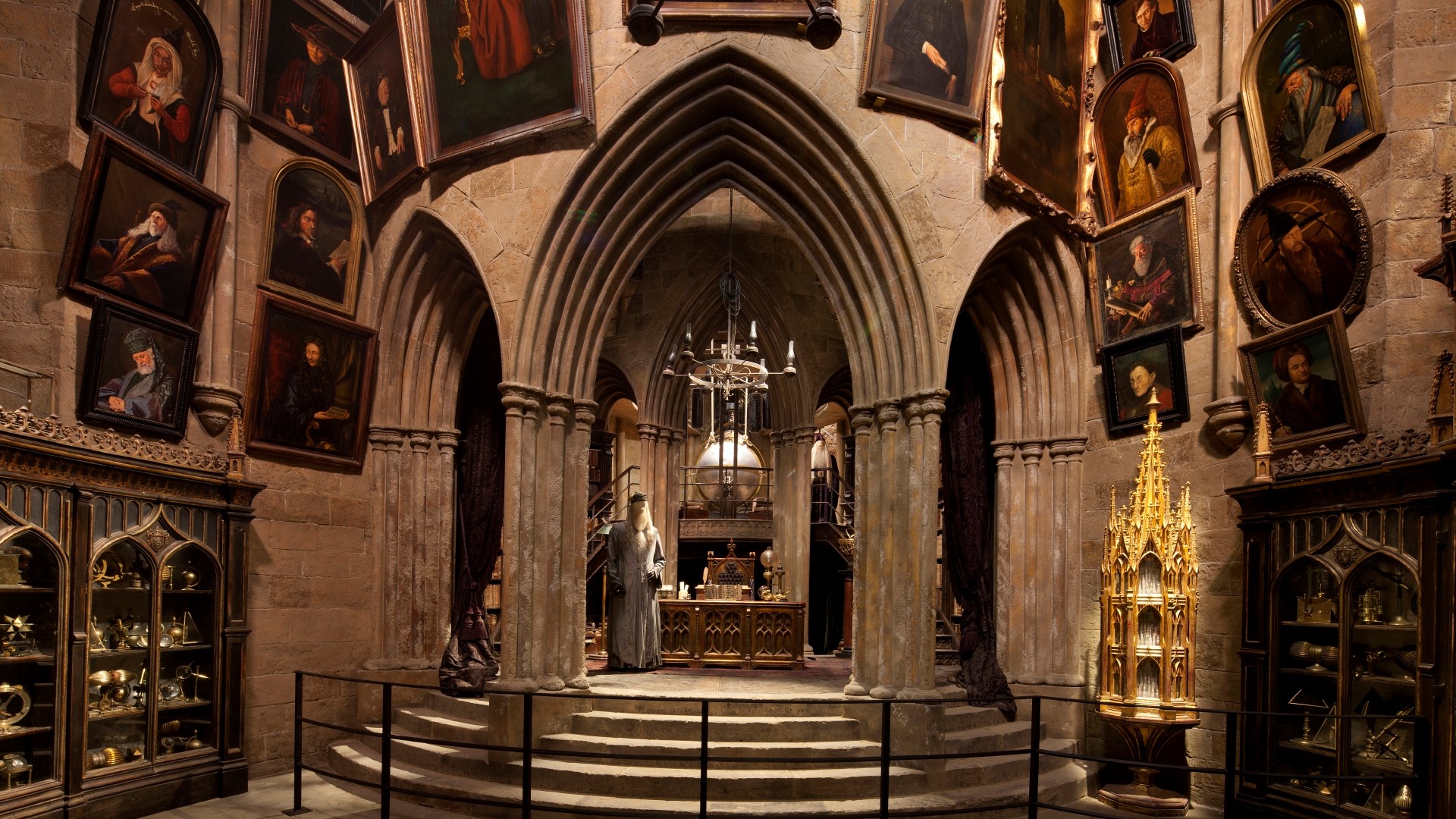 Explore Dumbledore's office on set at Warner Bros Studio Tour London. Credit: Warner Bros Studio Tour London. Image courtesy of Warner Bros Studio Tour London – The Making of Harry Potter. The Dumbledore office set, including stairs, pictures on the wall and Dumbledore costume, at Warner Bros Studio Tour London