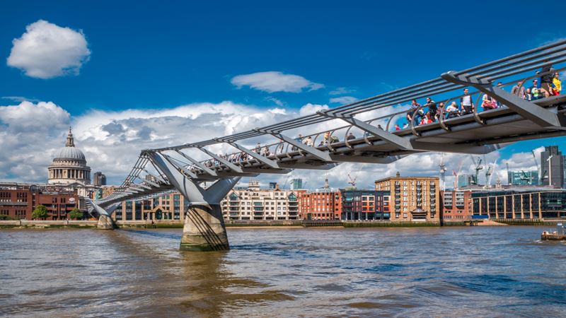 Check out Millennium Bridge, famously destroyed by the Death Eaters in Harry Potter and the Half-Blood Prince. Credit: Shutterstock. Image courtesy of Shutterstock. low angle shot of the steel bridge, built across the river Thames connect central London to south London.