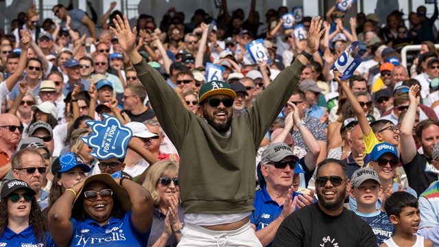 A man cheers on from the stands at The Hundred