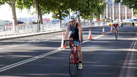 A cyclist makes their way down Victoria embankment away from the Houses of Parliament.  Image courtesy of OCD Studios.