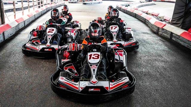 Go karts lined up towards the camera, ready to set off on the track at Teamsport London Docklands.