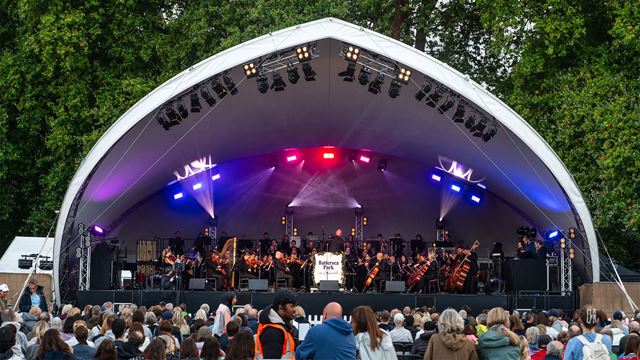 Crowds stand in front of the stage at Battersea Park in Concert 