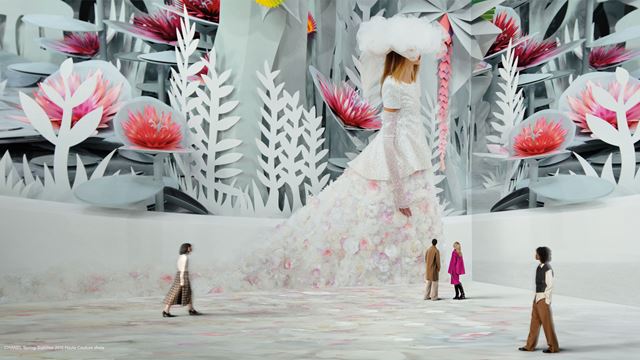 Chanel catwalk from Vogue's archives on walls at Lightroom.