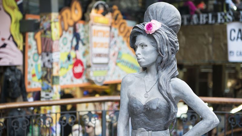 Snap photos with the iconic Amy Winehouse statue in Camden Market. Credit: Shutterstock. Image courtesy of Shutterstock. Amy Winehouse statue in Camden Stables.