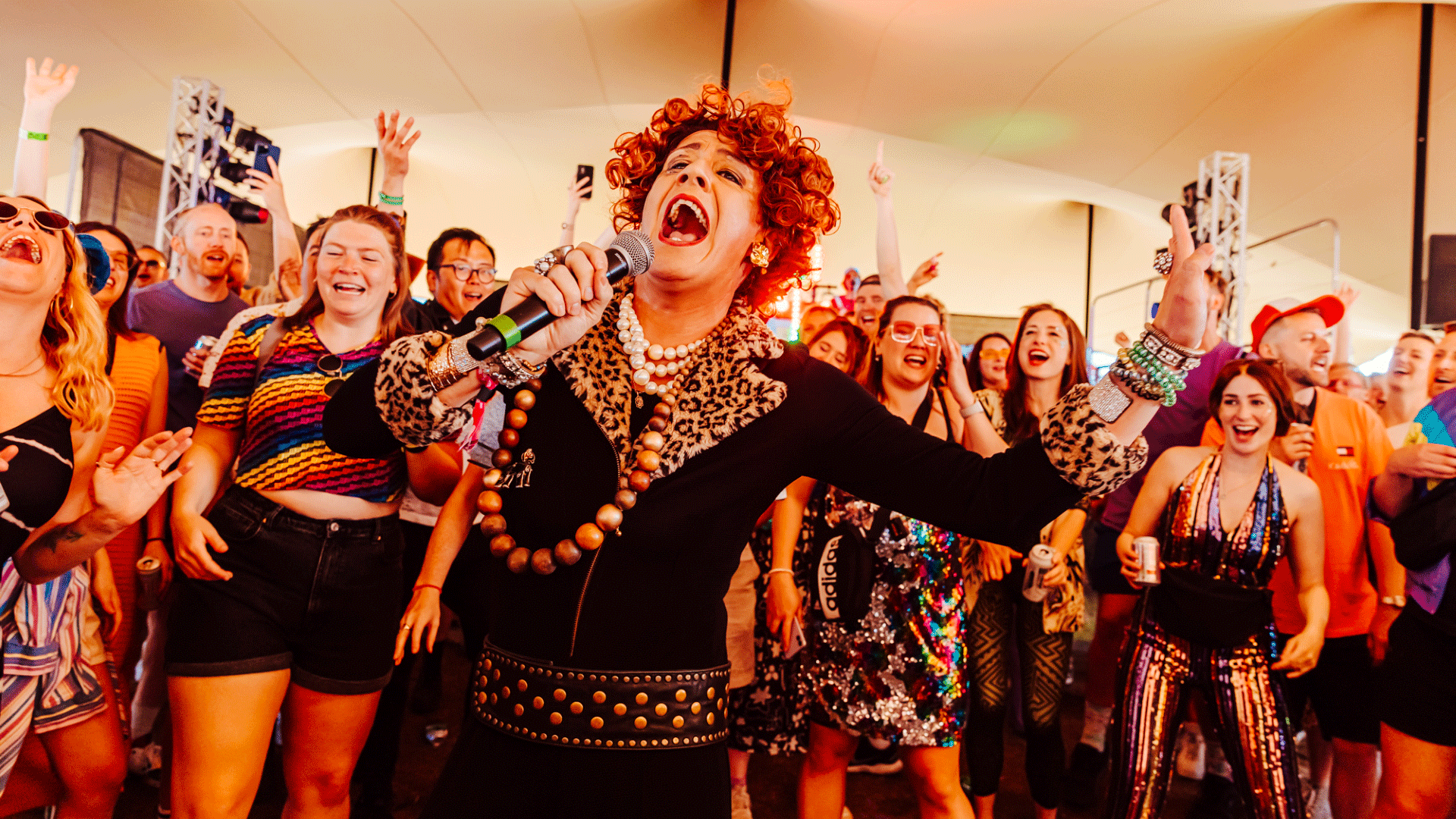 Drag queen performs in front of excited festival crowd