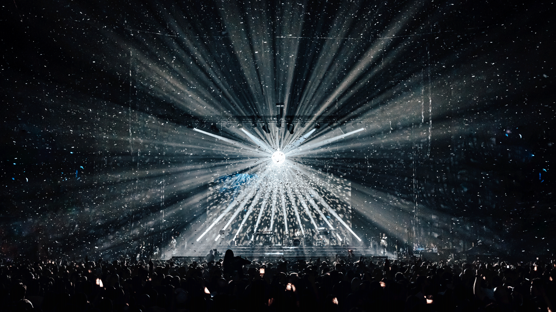 Lights shine off a disco ball at The O2 as Sugababes play