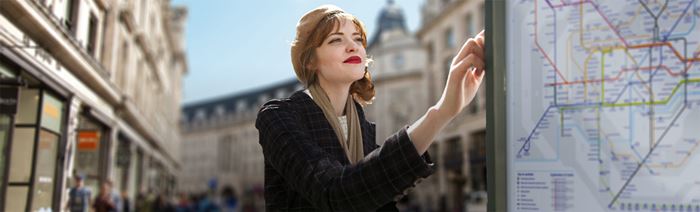 Woman reading a London map in Regent Street