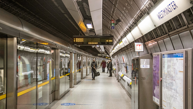 People waiting for the Night Tube on the platform at a London Underground station