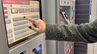 Follow the easy steps to purchase tickets on machines across London's stations. Credit: Shutterstock. Image courtesy of Shutterstock. A photo of a woman's finger touching the buttons on a touchscreen ticket machine at a train station