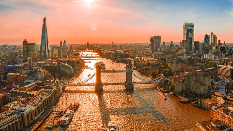 Find an array of accommodation options in central London and Wimbledon during The Championships. Image courtesy of Shutterstock. An aerial view of London at sunset overlooking the river Thames