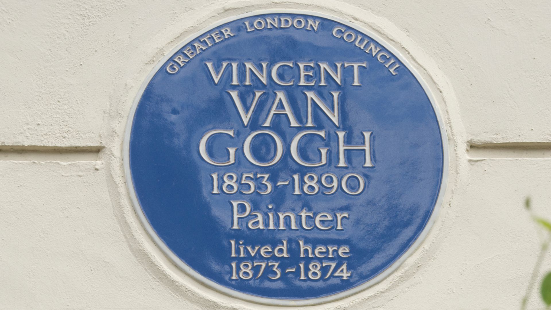 Vincent van gogh blue plaque on a white wall in London.