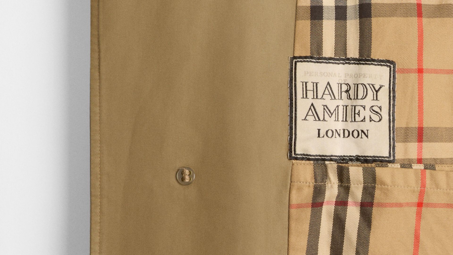 Close-up view of Burberry coat with Hardy Amies label on inside.