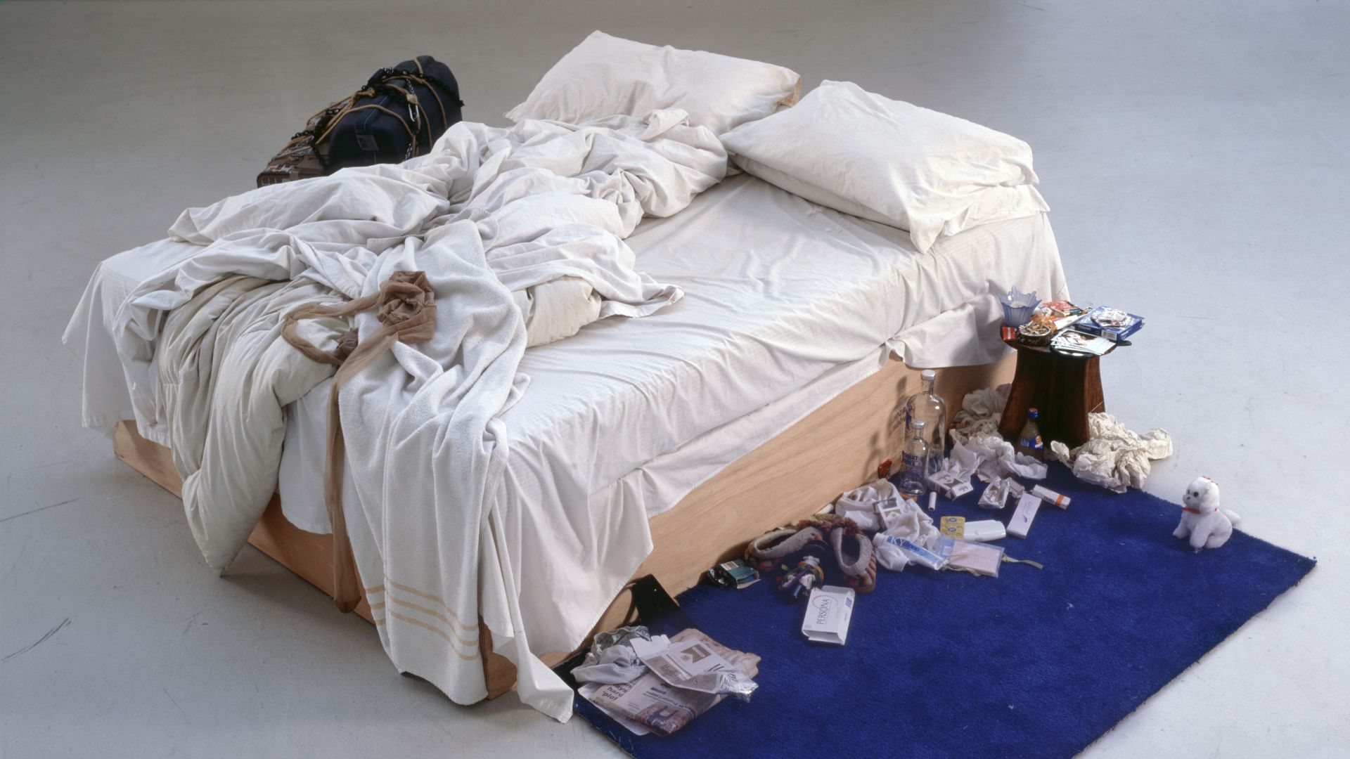 Tracey Emin My Bed 1998 © Tracey Emin. Photo credit: The Saatchi Gallery, London Photograph by Prudence C. Image courtesy of Tate Modern. Tracey Emin My Bed featuring an unmade bed and a series of items surrounding it.
