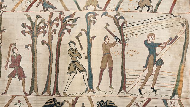 Thsi piece of the Bayeux Tapestry depicts a medieval scene in which men with axes are cutting down trees.