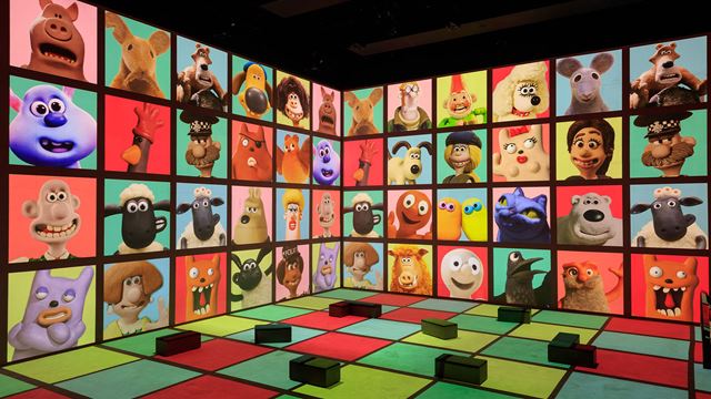 The Lightroom viewing gallery is filled with multicoloured patterns, with cases displaying different characters from Aardman Studios, including Wallace and Gromit.