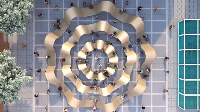 An aerial view from above of Please Be Seated by Paul Cocksedge, which is made up of three concentric gold-coloured circles.