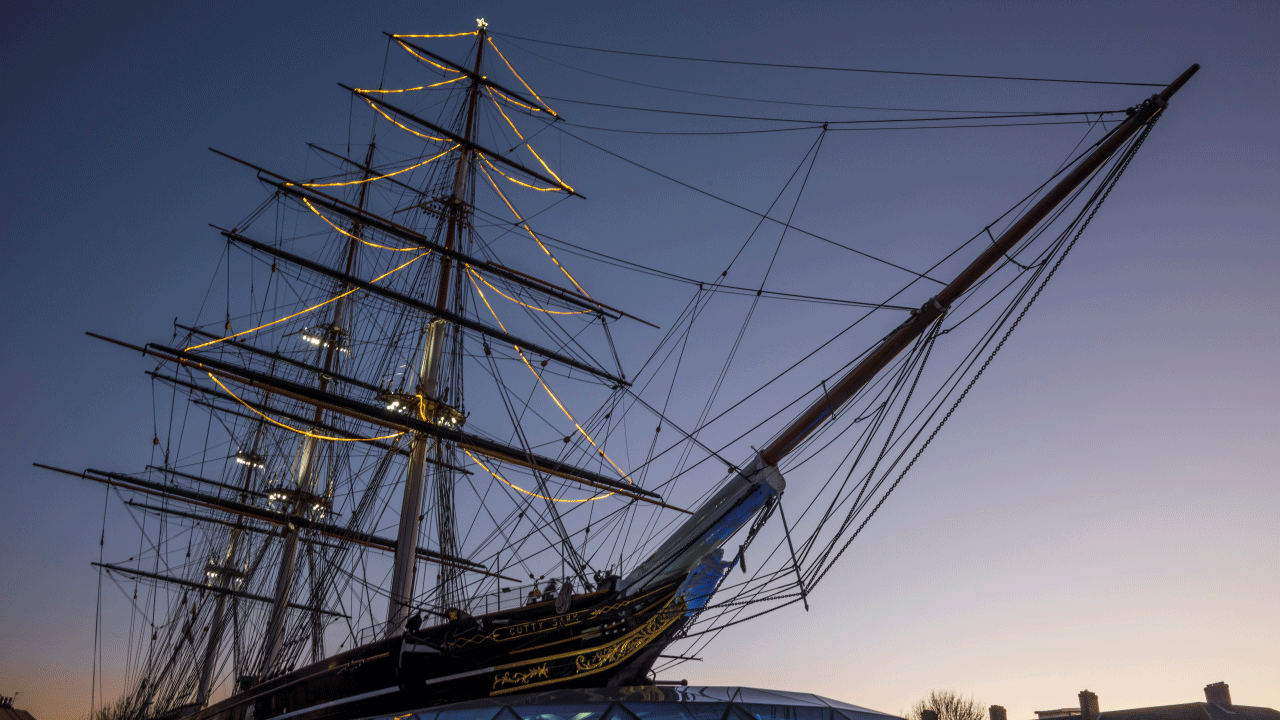 Lights decorate the rigging of Cutty Sark in the shape of a Christmas tree