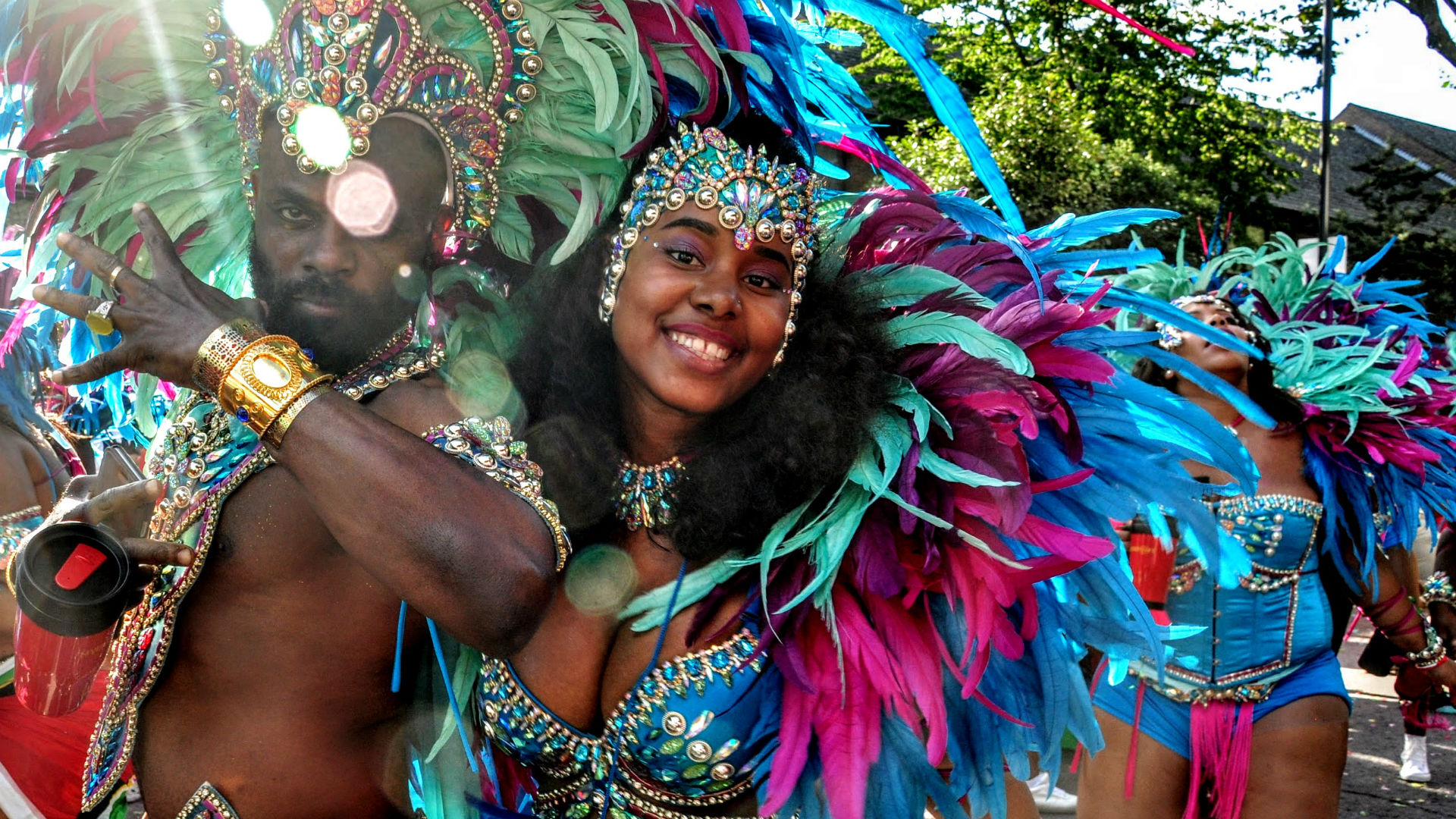 A woman wearing a coloured Caribbean costume at Notting Hill Carnival 2016.