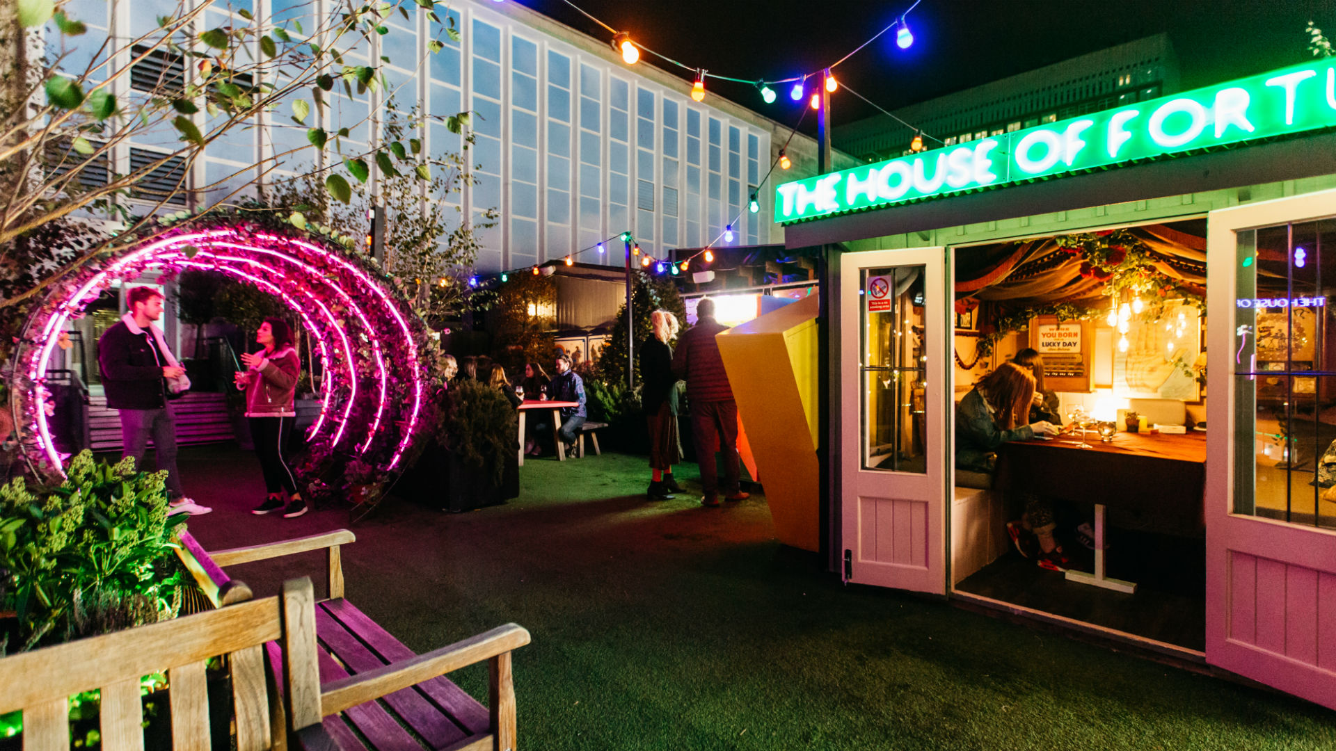 A photo of The Winter Carnival at John Lewis Rooftop, with some flashing banners and lights.