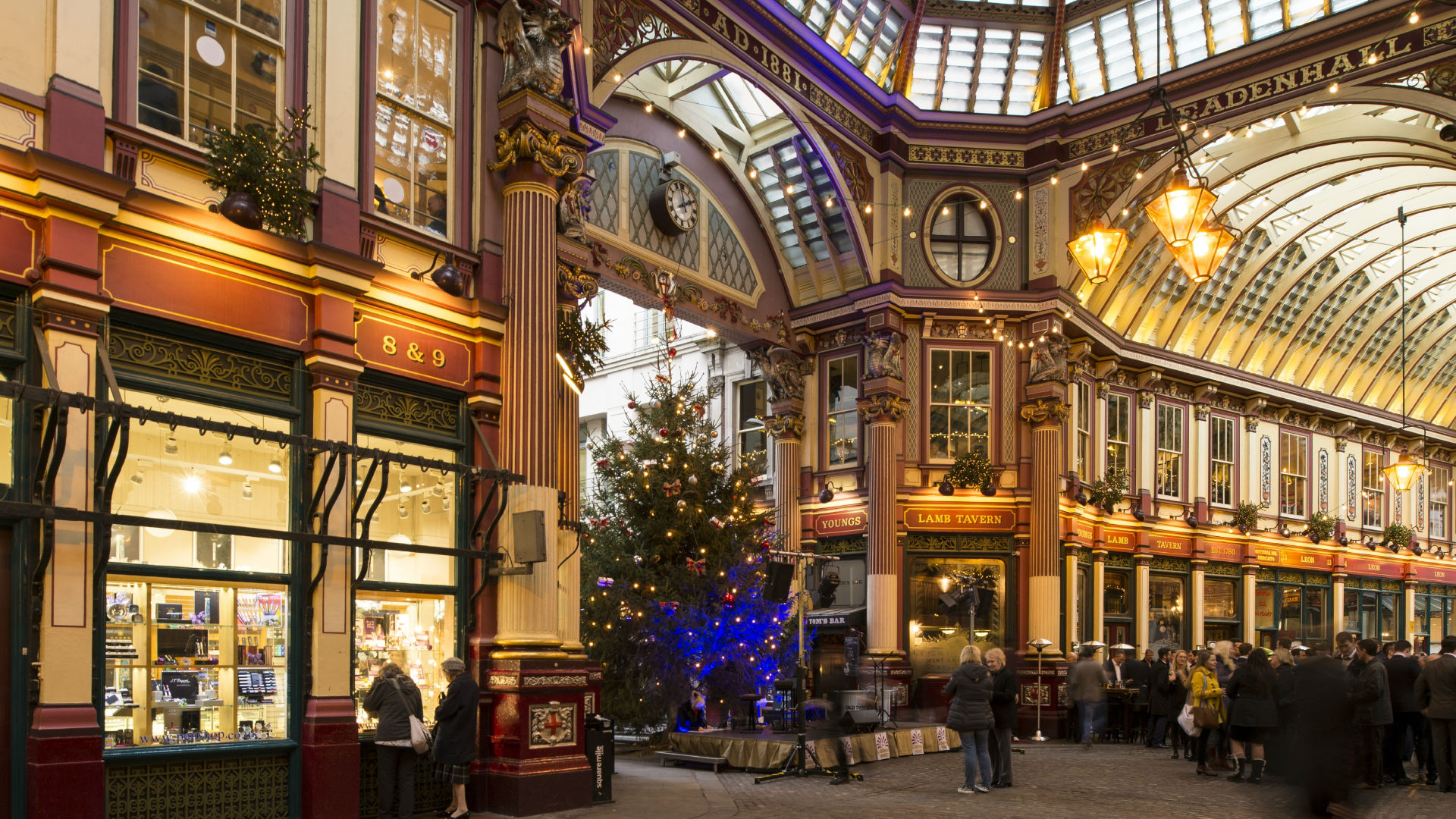 A photo of the ominously lit Leadenhall Market decorated for the festive season.
