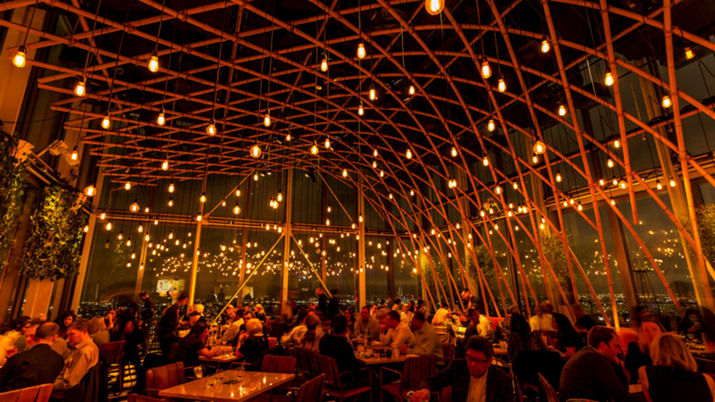 The interior of Sushisamba by evening, people enjoying themselves. 