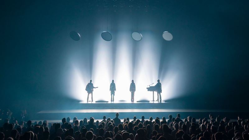 Get your glitter on and prepare to sing your heart out at ABBA Voyage at ABBA Arena. Credit: ABBA Voyage. Image courtesy of ABBA Voyage. ABBA Voyage performers on stage with crowd cheering in the foreground, during a live performance at London's ABBA Arena.