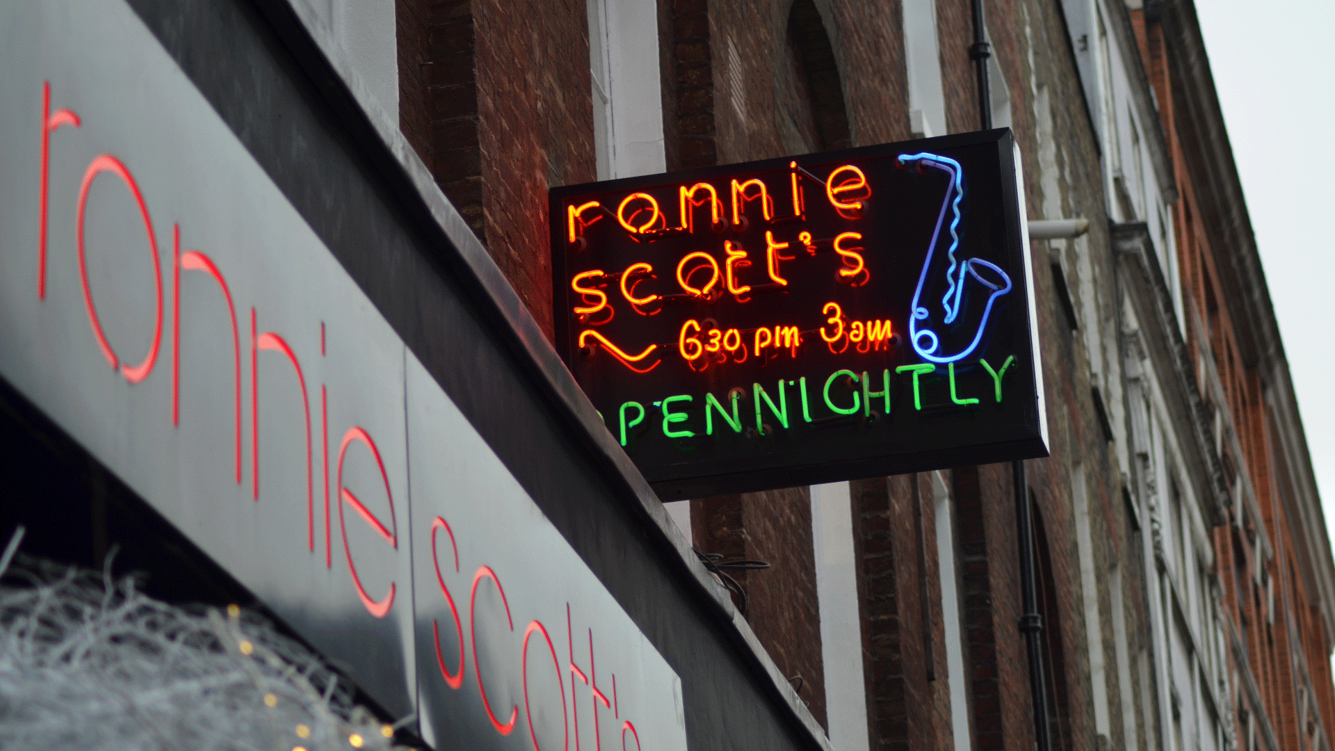 Neon sign to Ronnie Scott's jazz club which says 