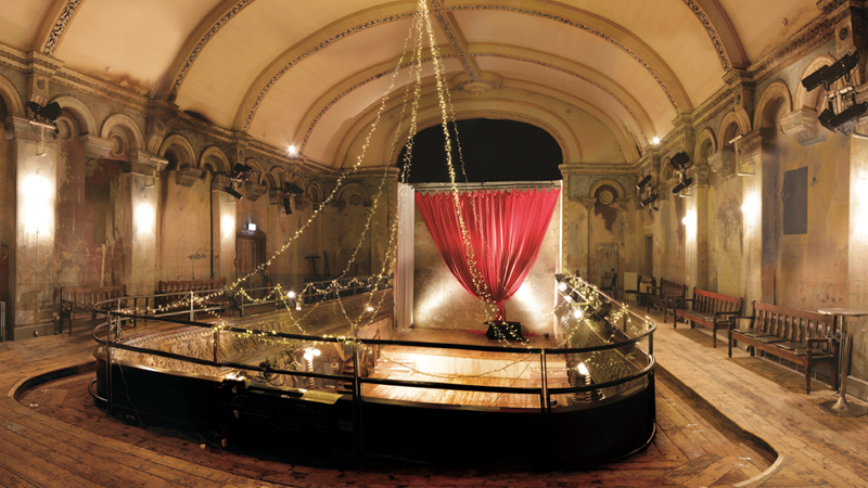 Enjoy classical concerts at the grade II-listed Wilton's Auditorium, originally built in 1858. Image courtesy of Wilton's Music Hall. Image courtesy of Wilton's Music Hall. View of Wilton's Auditorium from above with many preserved traditional features including a red curtain on stage