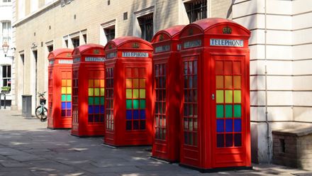 Even London's famous red phone boxes get a rainbow makeover during Pride. Credit: Emma Barbieri. Image courtesy of Shutterstock.