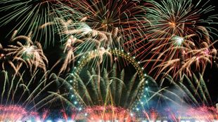 Fireworks surround the London Eye on New Year's Eve